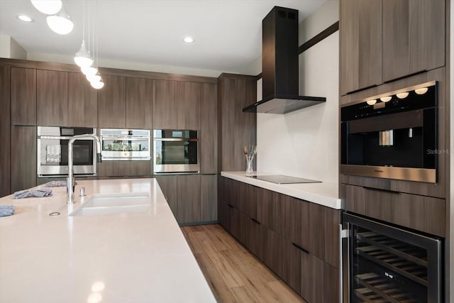 16047 Redington Dr, Redington Beach, FL 33708 - kitchen featuring range hood, wine cooler, modern cabinets, and light countertops