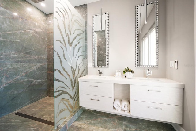 16047 Redington Dr, Redington Beach, FL 33708 - bathroom featuring marble look tiles, double vanity, and a marble finish shower