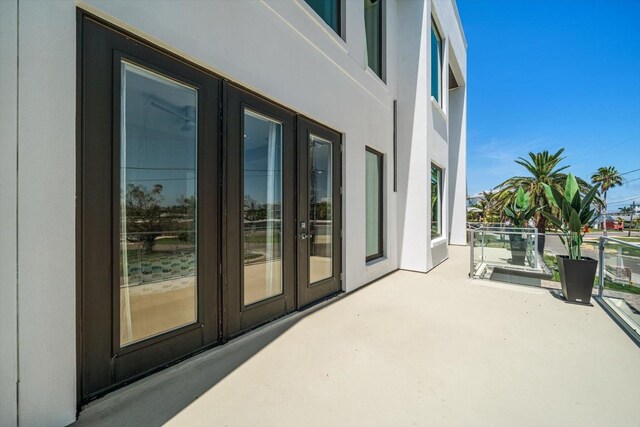16047 Redington Dr, Redington Beach, FL 33708 - view of patio featuring french doors and a balcony