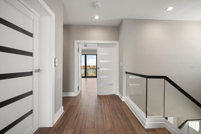 16047 Redington Dr, Redington Beach, FL 33708 - hall featuring baseboards, wood finished floors, and recessed lighting