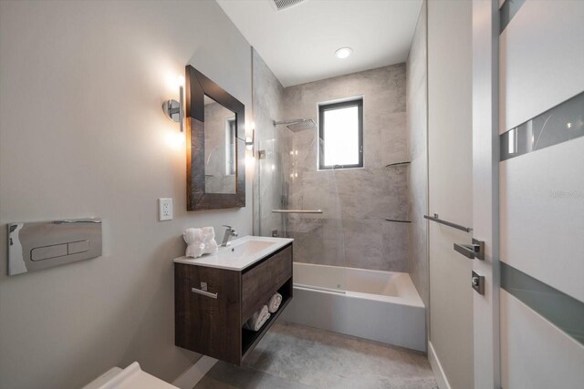 16047 Redington Dr, Redington Beach, FL 33708 - bathroom featuring vanity, shower / bath combination, and toilet