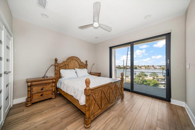 16047 Redington Dr, Redington Beach, FL 33708 - bedroom with access to exterior, baseboards, light wood finished floors, a ceiling fan, and recessed lighting