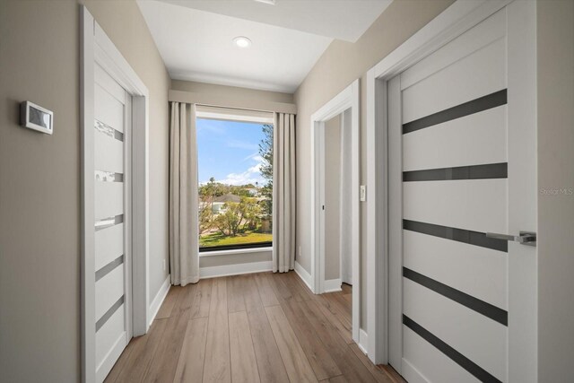 16047 Redington Dr, Redington Beach, FL 33708 - hall with wood finished floors, baseboards, and recessed lighting