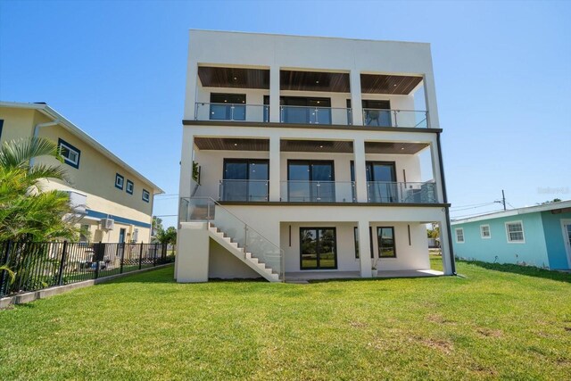 16047 Redington Dr, Redington Beach, FL 33708 - back of house with stucco siding, stairs, and a balcony
