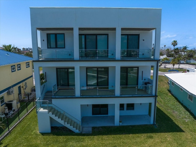 16047 Redington Dr, Redington Beach, FL 33708 - back of property featuring a balcony, stairs, stucco siding, and cooling unit