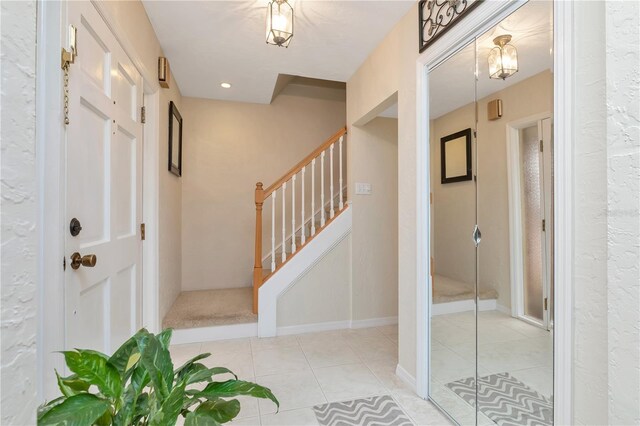 9465 126th Ave, Largo, FL 33773 - entryway with stairs and light tile patterned floors