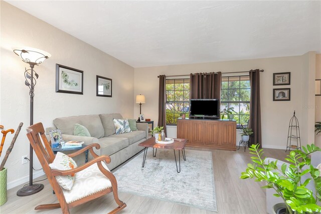 9465 126th Ave, Largo, FL 33773 - living area featuring baseboards and wood finished floors