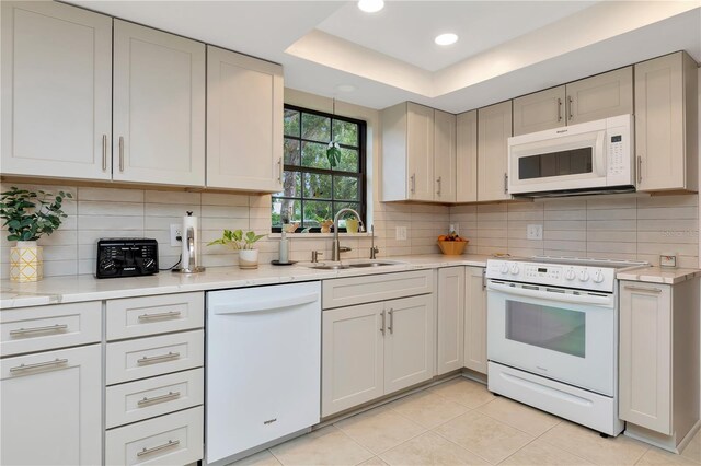 9465 126th Ave, Largo, FL 33773 - kitchen with white appliances, a sink, light countertops, backsplash, and recessed lighting