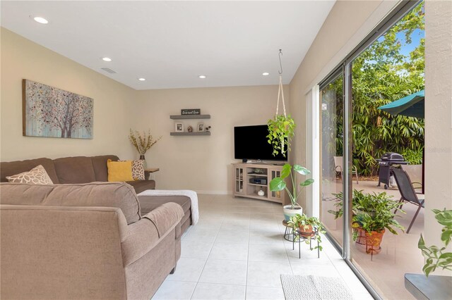 9465 126th Ave, Largo, FL 33773 - living room with light tile patterned flooring, recessed lighting, and baseboards