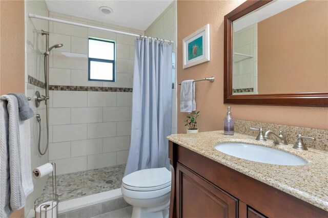 9465 126th Ave, Largo, FL 33773 - full bathroom featuring vanity, toilet, and tiled shower