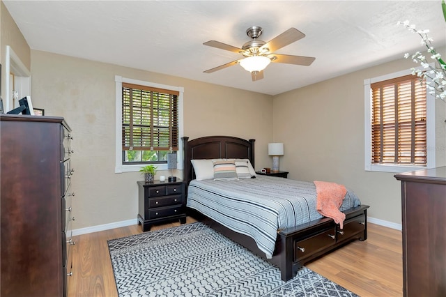 9465 126th Ave, Largo, FL 33773 - bedroom featuring wood finished floors, baseboards, and a ceiling fan