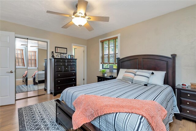 9465 126th Ave, Largo, FL 33773 - bedroom featuring wood finished floors, a closet, and a ceiling fan