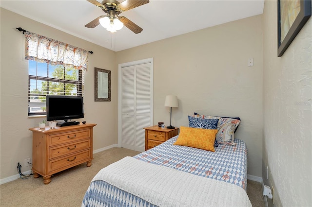 9465 126th Ave, Largo, FL 33773 - bedroom with light carpet, a closet, baseboards, and ceiling fan
