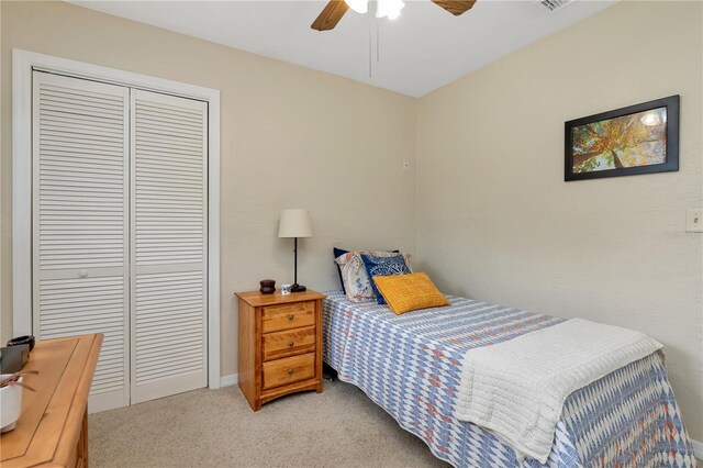 9465 126th Ave, Largo, FL 33773 - bedroom with a closet, light carpet, ceiling fan, and baseboards