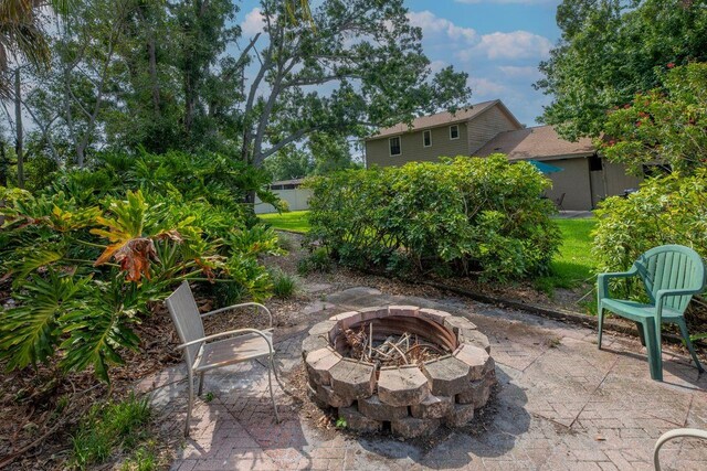 9465 126th Ave, Largo, FL 33773 - view of patio with an outdoor fire pit