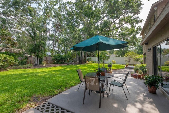 9465 126th Ave, Largo, FL 33773 - view of patio / terrace with outdoor dining area