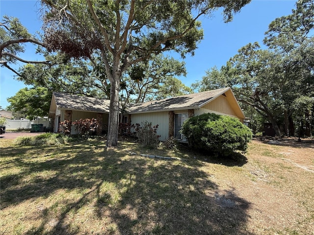 2033 Aaron Pl, Clearwater, FL 33760 - view of home's exterior with a lawn