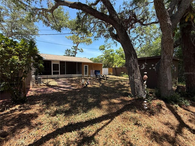 2033 Aaron Pl, Clearwater, FL 33760 - view of yard with a sunroom