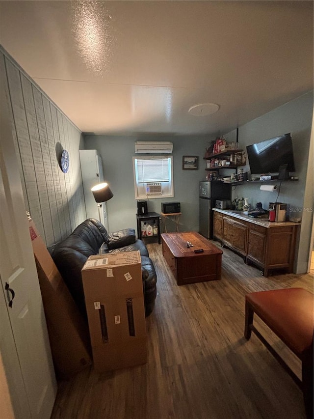2033 Aaron Pl, Clearwater, FL 33760 - living area featuring dark wood-style flooring, a wall unit AC, and wooden walls
