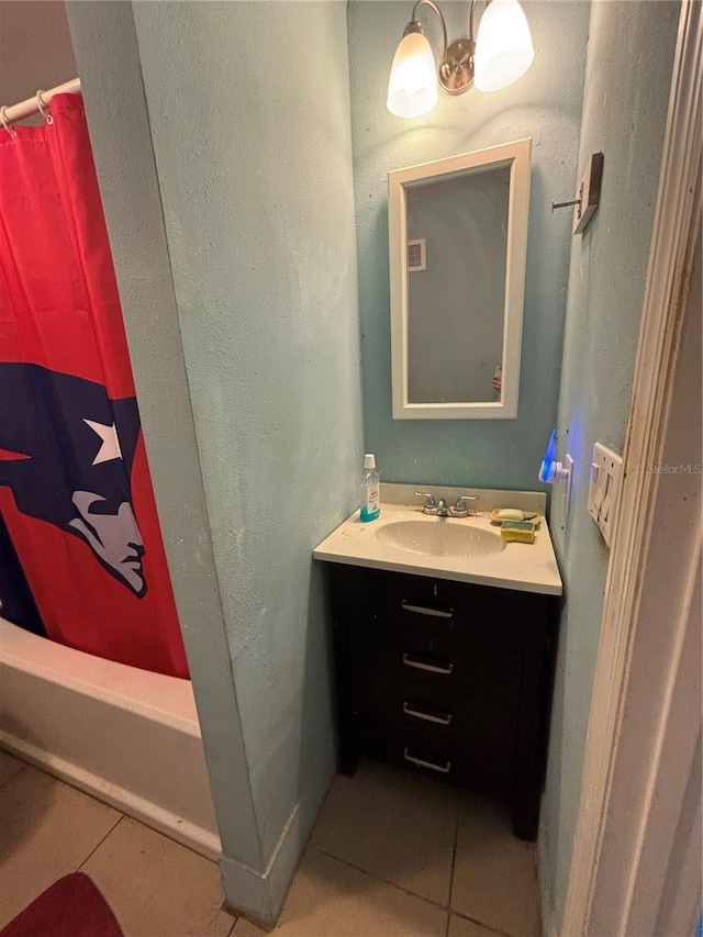 2033 Aaron Pl, Clearwater, FL 33760 - bathroom with tile patterned floors, vanity, and shower / bath combination with curtain