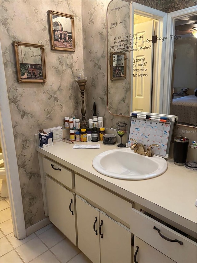 2033 Aaron Pl, Clearwater, FL 33760 - bathroom with vanity, tile patterned floors, and wallpapered walls