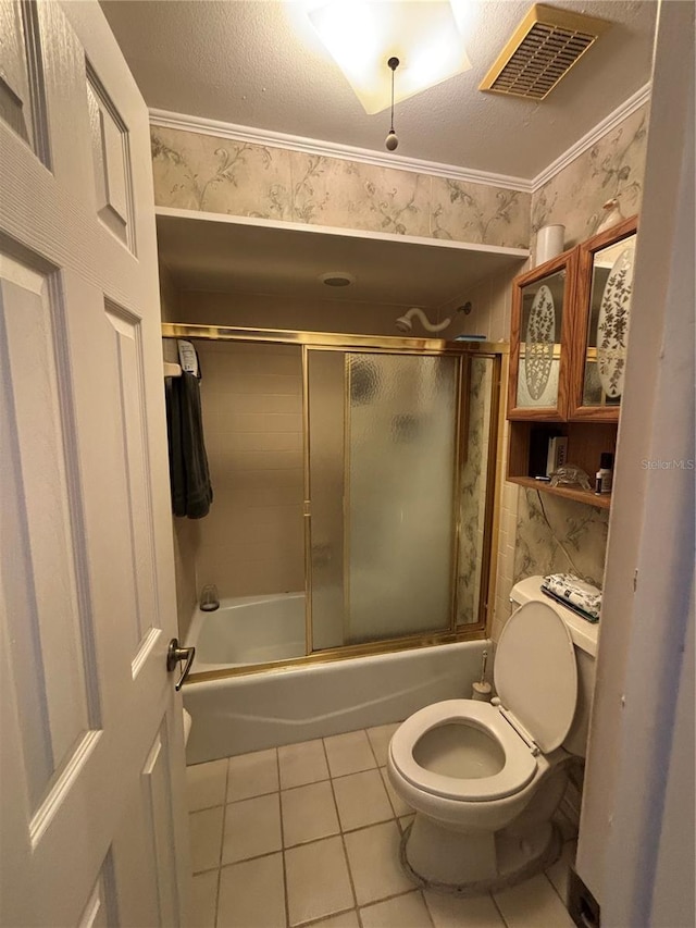 2033 Aaron Pl, Clearwater, FL 33760 - bathroom featuring tile patterned floors, toilet, shower / bath combination with glass door, and wallpapered walls