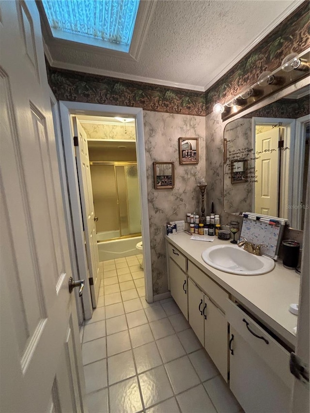2033 Aaron Pl, Clearwater, FL 33760 - bathroom with tile patterned flooring, vanity, wallpapered walls, toilet, and enclosed tub / shower combo