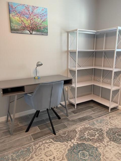 2714 60th Avenue Terrace W Unit 12D, Bradenton, FL 34207 - unfurnished office with wood finish floors and baseboards