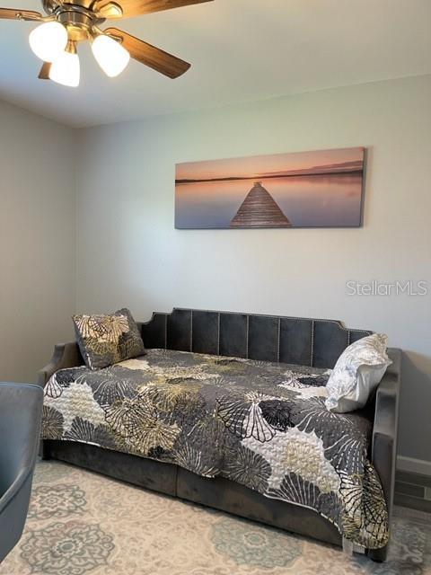 2714 60th Avenue Terrace W Unit 12D, Bradenton, FL 34207 - bedroom with baseboards and ceiling fan