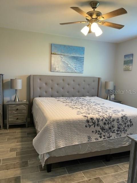 2714 60th Avenue Terrace W Unit 12D, Bradenton, FL 34207 - bedroom featuring a ceiling fan and wood finished floors