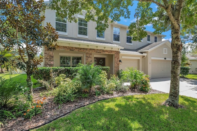 10833 Breaking Rocks Dr, Tampa, FL 33647 - view of front of home featuring stucco siding, concrete driveway, an attached garage, a front yard, and stone siding