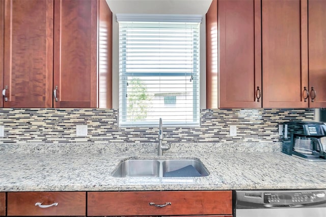 10833 Breaking Rocks Dr, Tampa, FL 33647 - kitchen featuring dishwasher, a sink, tasteful backsplash, and light stone countertops