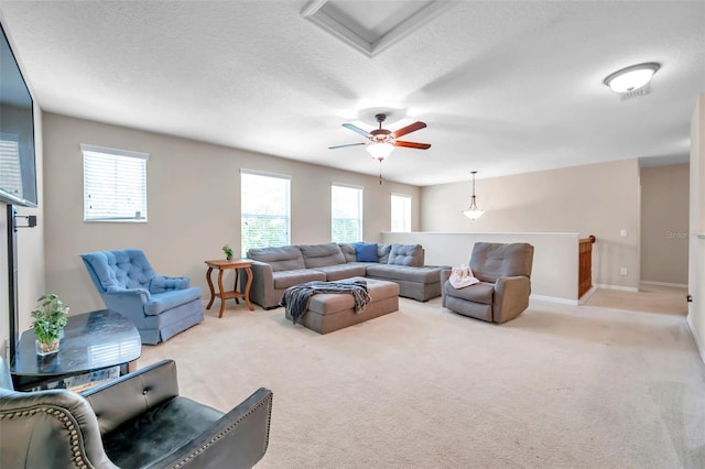 10833 Breaking Rocks Dr, Tampa, FL 33647 - living room with carpet floors, ceiling fan, a textured ceiling, and baseboards
