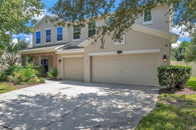 10833 Breaking Rocks Dr, Tampa, FL 33647 - traditional-style home featuring an attached garage, concrete driveway, and stucco siding
