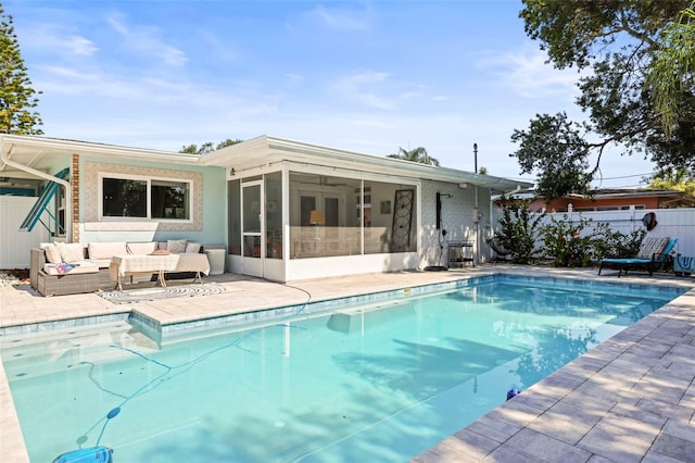 2479 Trade Winds Dr, Dunedin, FL 34698 - view of swimming pool with an outdoor hangout area, a sunroom, and a patio