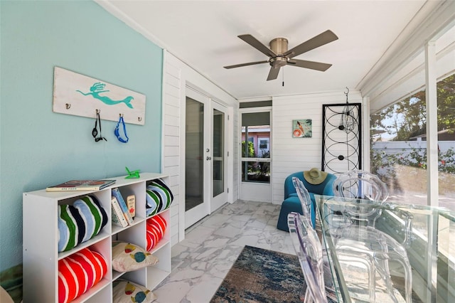 2479 Trade Winds Dr, Dunedin, FL 34698 - sunroom / solarium featuring french doors, plenty of natural light, and a ceiling fan