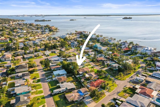 2479 Trade Winds Dr, Dunedin, FL 34698 - aerial overview of property's location with a nearby body of water and nearby suburban area