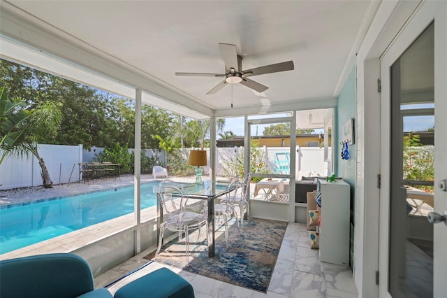 2479 Trade Winds Dr, Dunedin, FL 34698 - sunroom / solarium featuring ceiling fan, marble look tile flooring, outdoor lounge area, and ornamental molding