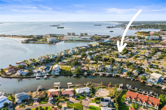2479 Trade Winds Dr, Dunedin, FL 34698 - aerial overview of property's location featuring a large body of water and nearby suburban area