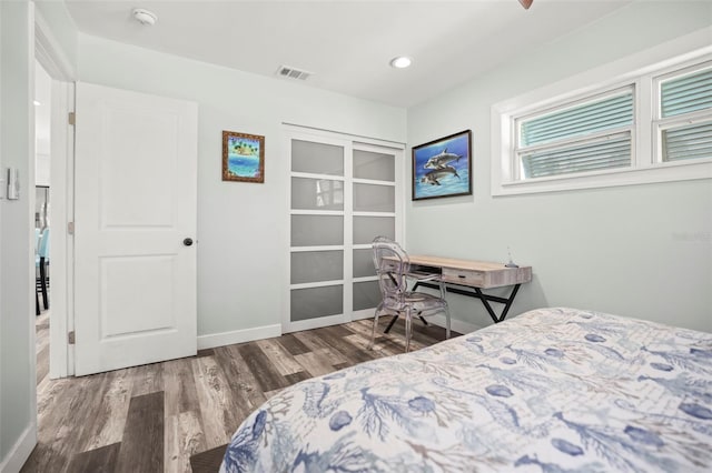 2479 Trade Winds Dr, Dunedin, FL 34698 - bedroom featuring wood finished floors, recessed lighting, and baseboards