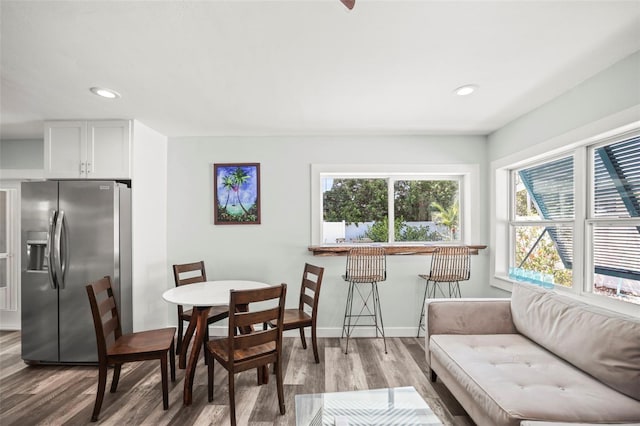 2479 Trade Winds Dr, Dunedin, FL 34698 - dining area with wood finished floors, plenty of natural light, recessed lighting, and baseboards