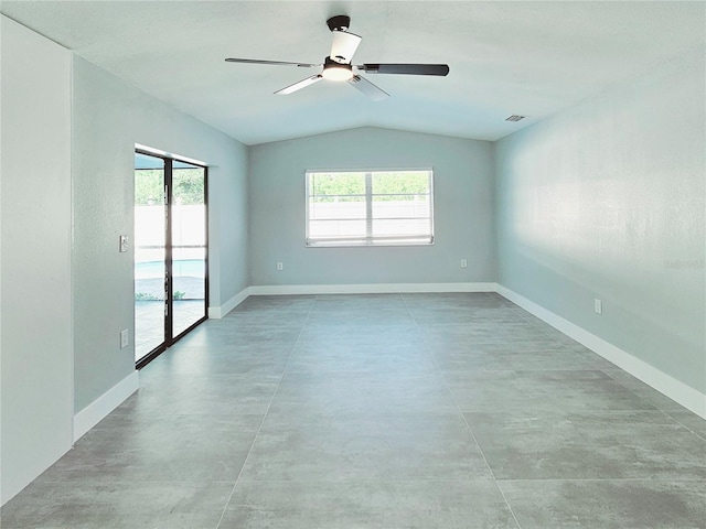 1178 Sultana St, Port Charlotte, FL 33952 - empty room featuring concrete floors, lofted ceiling, baseboards, and a ceiling fan