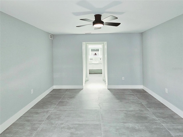 1178 Sultana St, Port Charlotte, FL 33952 - unfurnished room with finished concrete floors, a ceiling fan, and baseboards