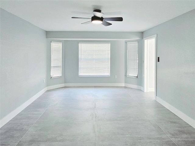1178 Sultana St, Port Charlotte, FL 33952 - empty room featuring concrete flooring, ceiling fan, and baseboards