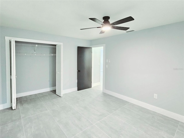 1178 Sultana St, Port Charlotte, FL 33952 - unfurnished bedroom with a closet, light tile patterned floors, ceiling fan, and baseboards