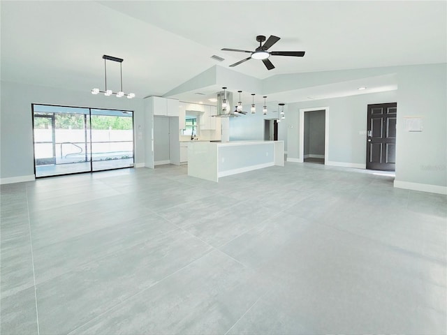1178 Sultana St, Port Charlotte, FL 33952 - unfurnished living room featuring baseboards, a chandelier, ceiling fan, vaulted ceiling, and a sink
