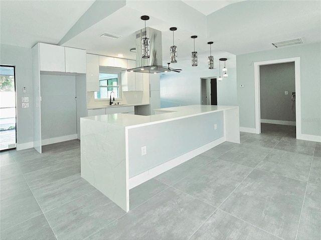 1178 Sultana St, Port Charlotte, FL 33952 - kitchen featuring a sink, modern cabinets, white cabinetry, light countertops, and plenty of natural light