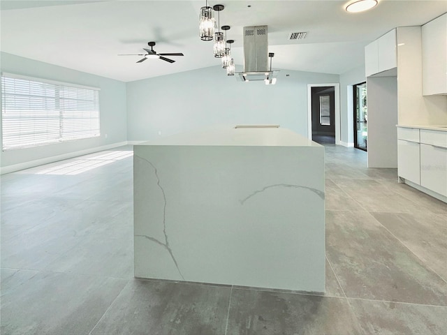 1178 Sultana St, Port Charlotte, FL 33952 - kitchen with modern cabinets, a ceiling fan, white cabinetry, vaulted ceiling, and decorative light fixtures