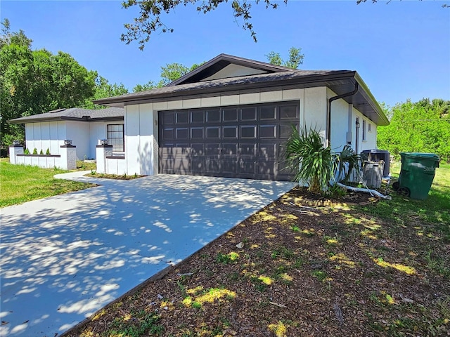 1178 Sultana St, Port Charlotte, FL 33952 - view of front facade with concrete driveway, an attached garage, and stucco siding
