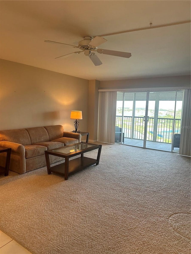10355 Paradise Blvd Unit 907, Treasure Island, FL 33706 - living room with a ceiling fan and carpet flooring